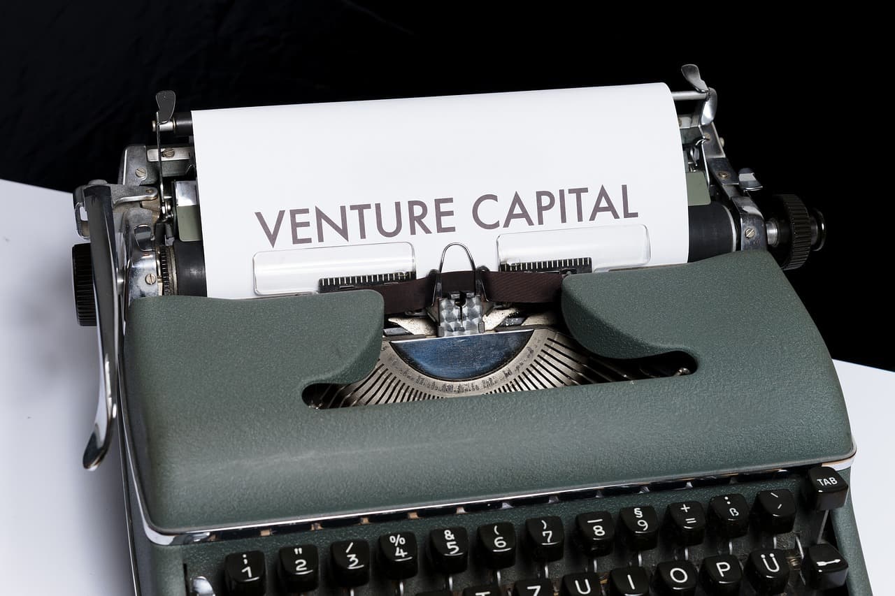 A typewriter with a paper showing the words 'Venture Capital'.