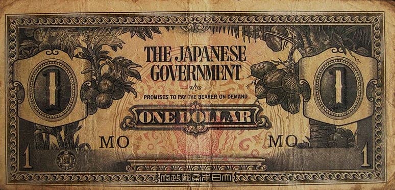 En gammal japansk en-dollarsedel med text och symboler.