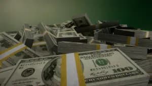 Högar av 100-dollarsedlar i amerikanska dollar.